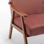 Poltroncina con schienale a orecchioni e gambe in legno massello