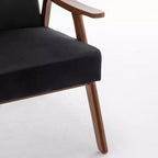 Poltroncina con schienale a orecchioni e gambe in legno massello