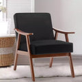 Poltroncina con schienale a orecchioni e gambe in legno massello