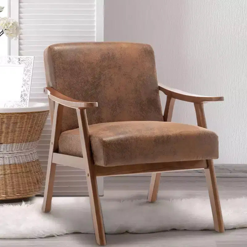 Poltroncina con schienale a orecchioni e gambe in legno massello