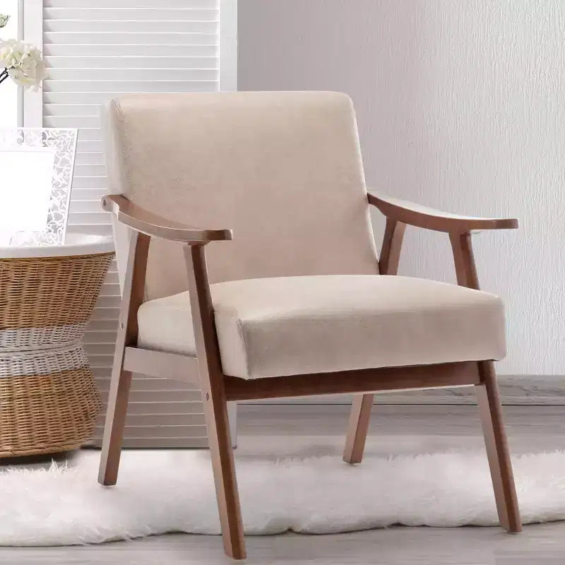 Poltroncina con schienale a orecchioni e gambe in legno massello